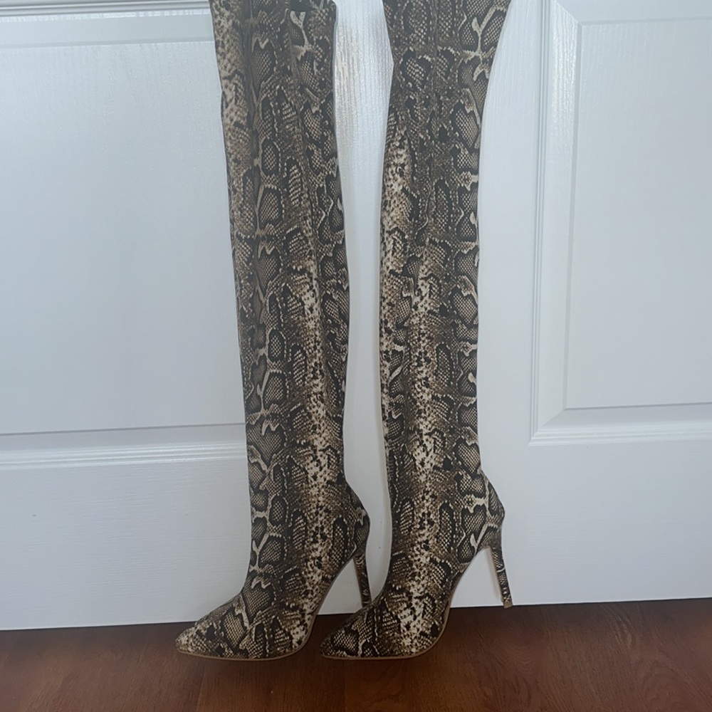 Thigh high snakeskin look boots